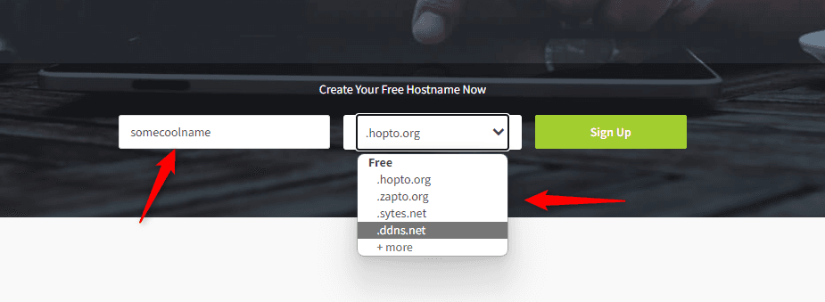 No-IP's Create Your Free Hostname form, with a hostname typed into the first field and the domain dropdown open on the free list: .hopto.org, .zapto.org, .sytes.net and .ddns.net.
